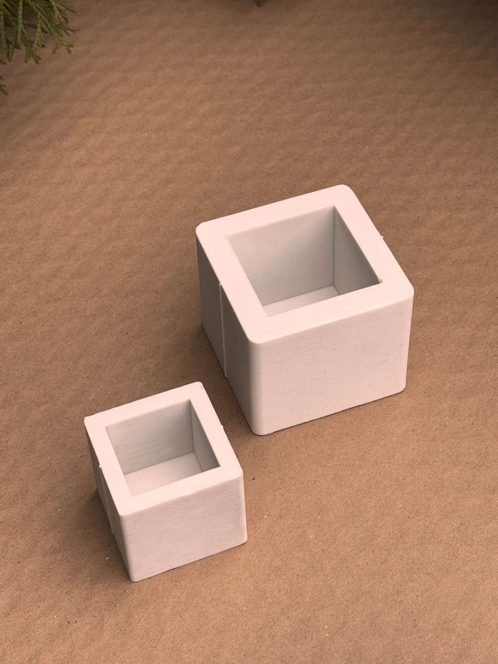 Silicone molds for small and medium cute cube candles.