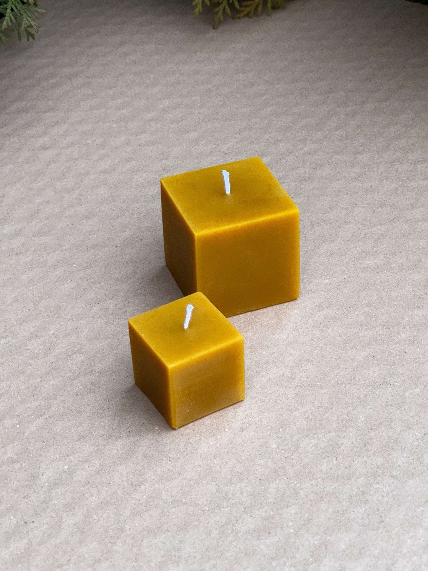 Silicone candle molds in small and medium cube sizes.