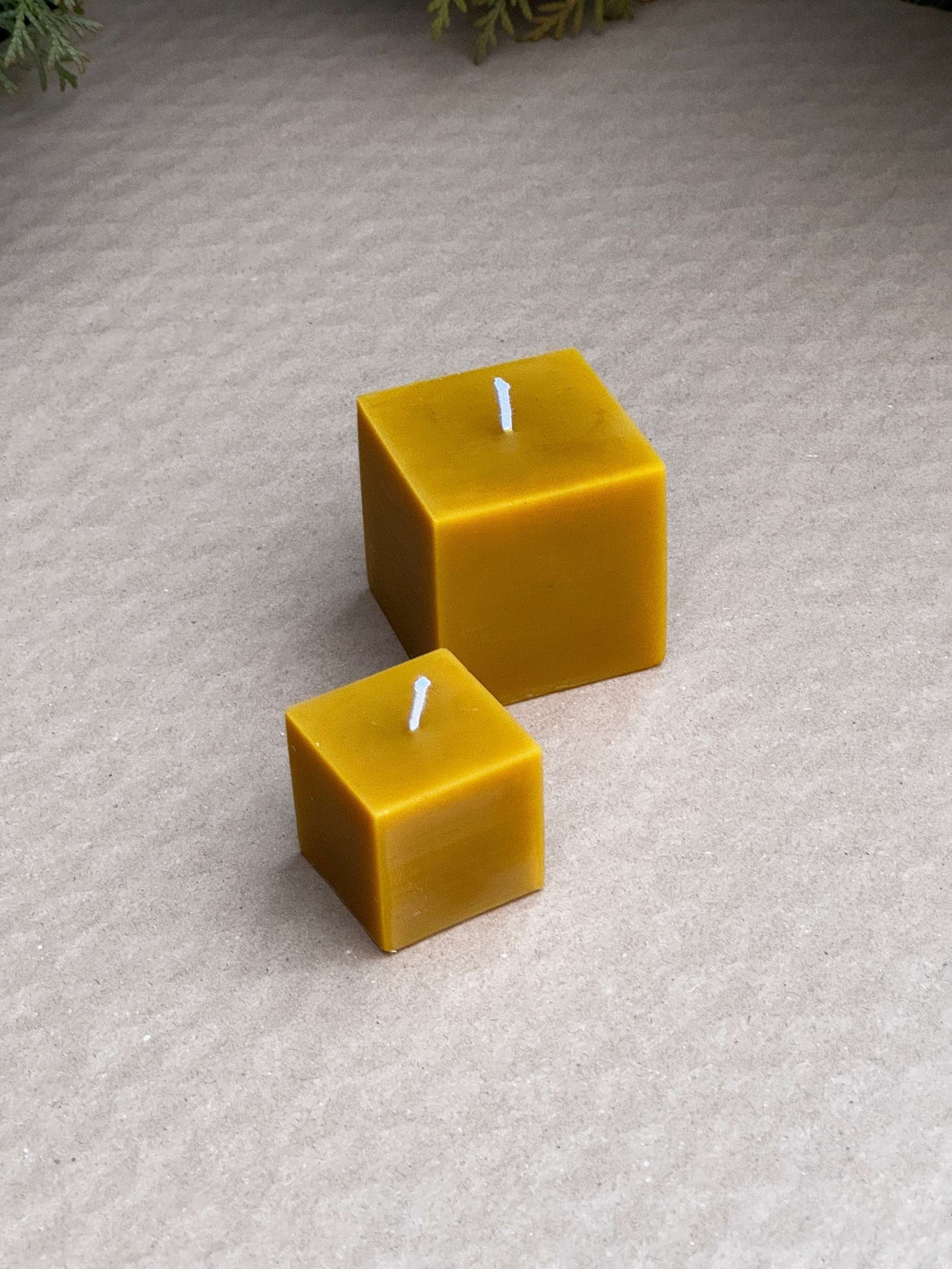 Silicone candle molds in small and medium cube sizes.