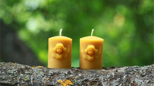 ANGEL'S FACE silicone candle molds featuring stylized angel designs on yellow candles.