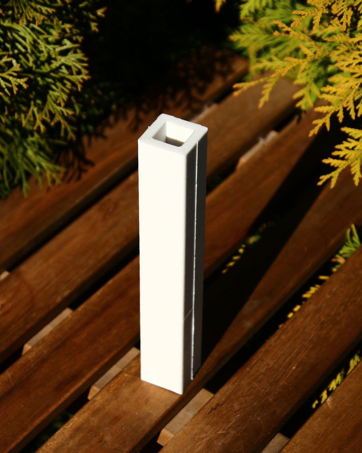 Close-up of the clean geometric lines on the beeswax candle