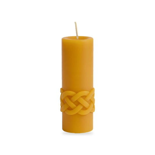 Celtic Waves beeswax candle, white background studio photo