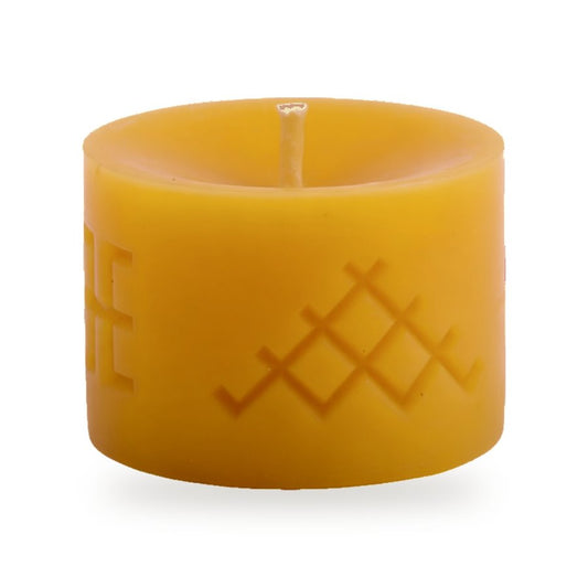 Ethno 2 beeswax candle, white background studio photo