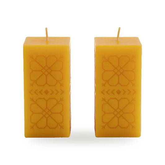 Sun Geometry beeswax candle, white background studio photo