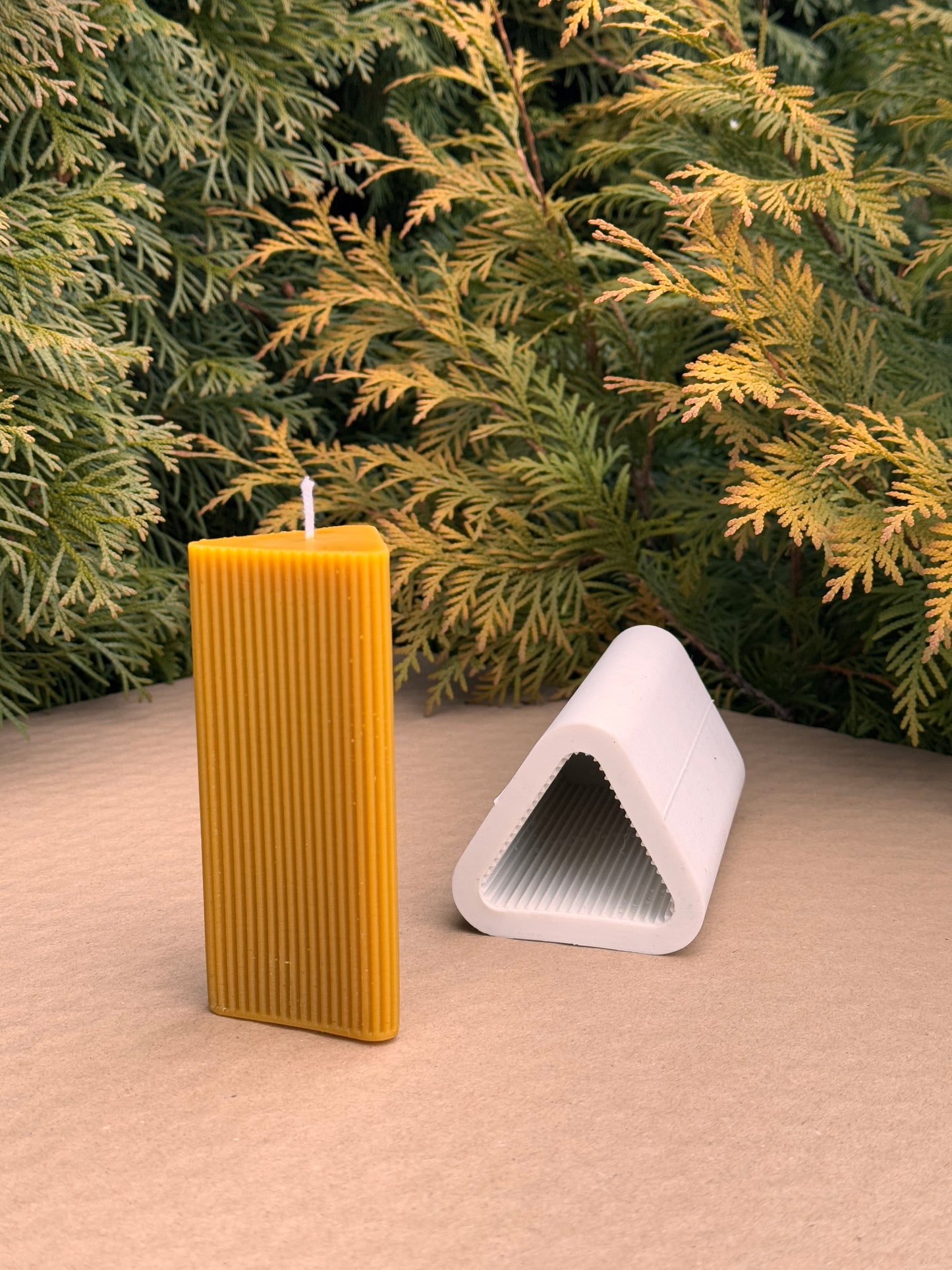 Tall beeswax candle with crisp geometric lines