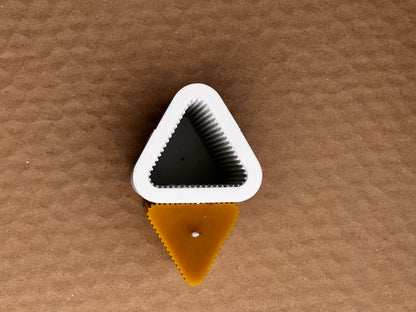 Decorative fluted beeswax pillar candle