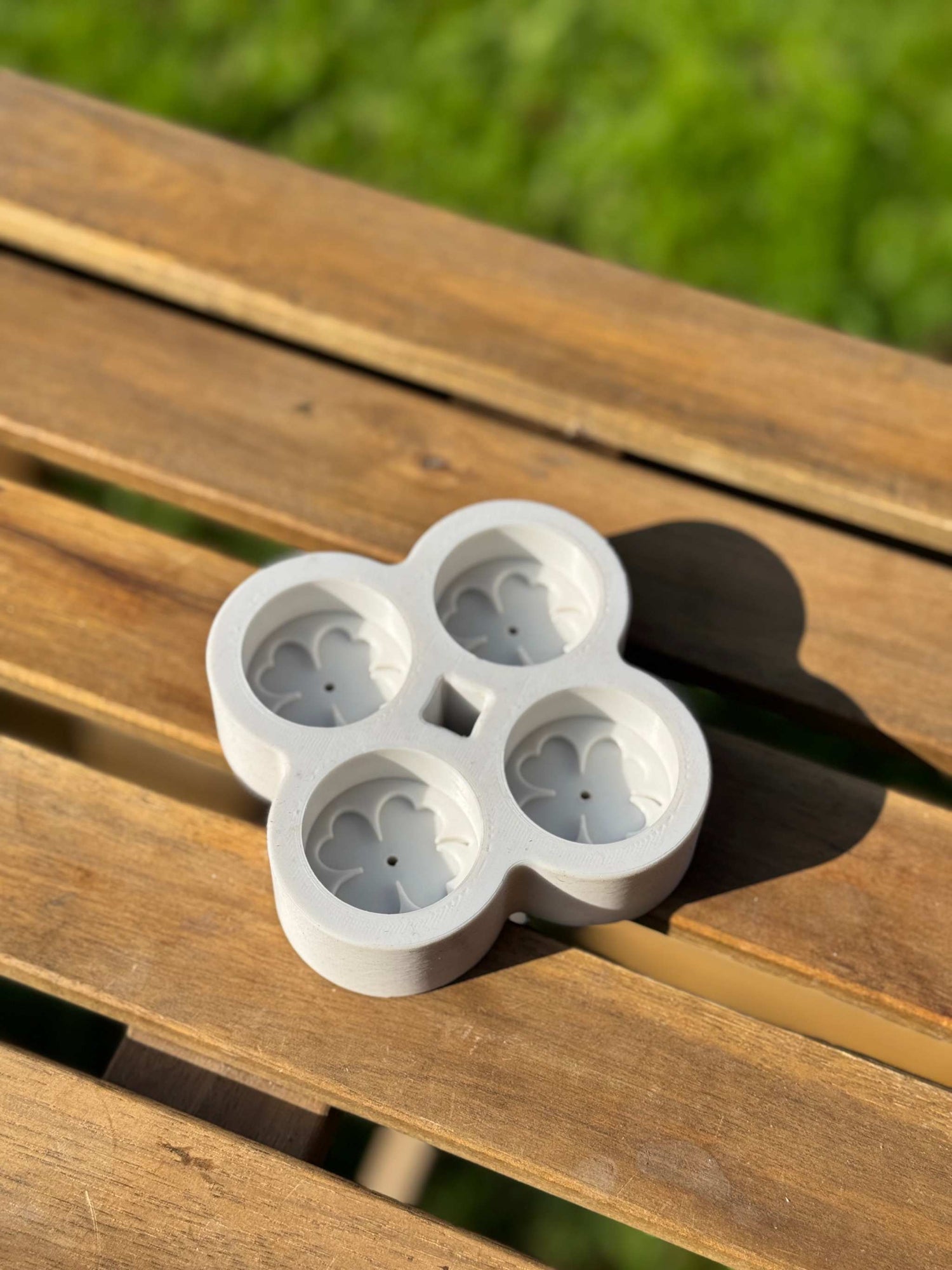 Top view of floral beeswax tea light candle