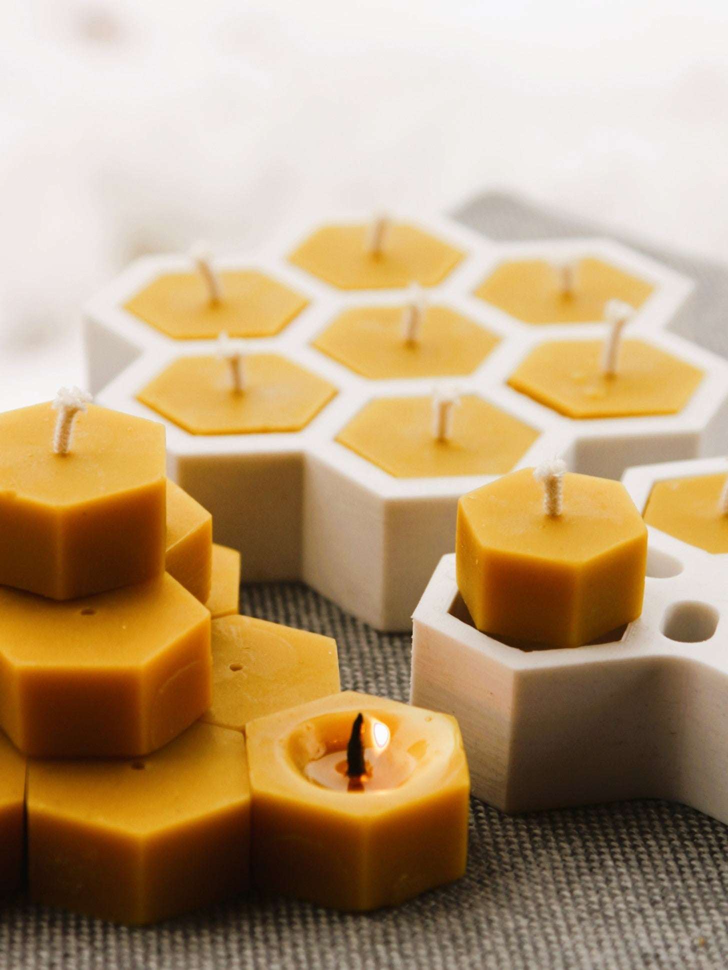 Small hexagon-shaped beeswax tea light candles