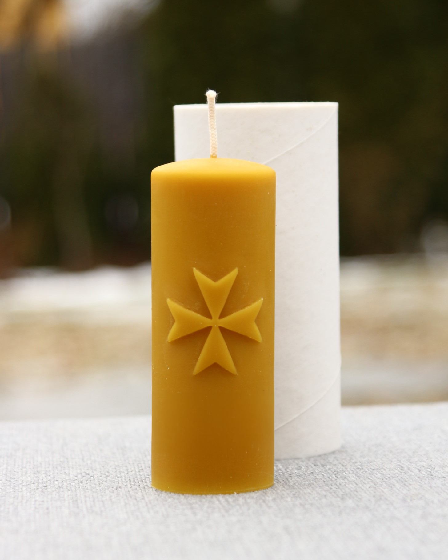 Beeswax candle shaped like a Maltese cross
