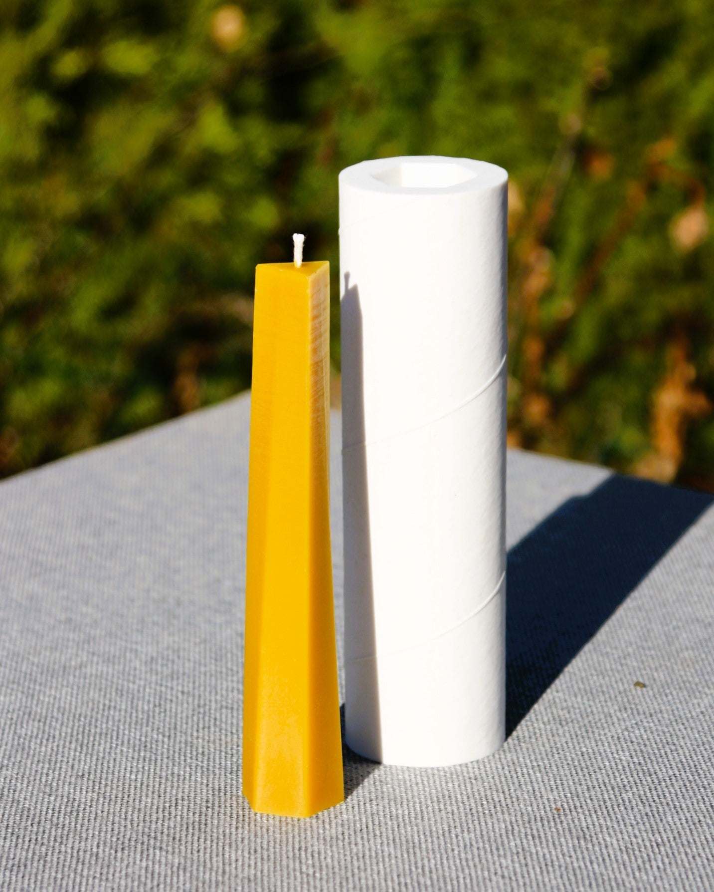 Beeswax candle with dynamic flame-inspired sculptural form