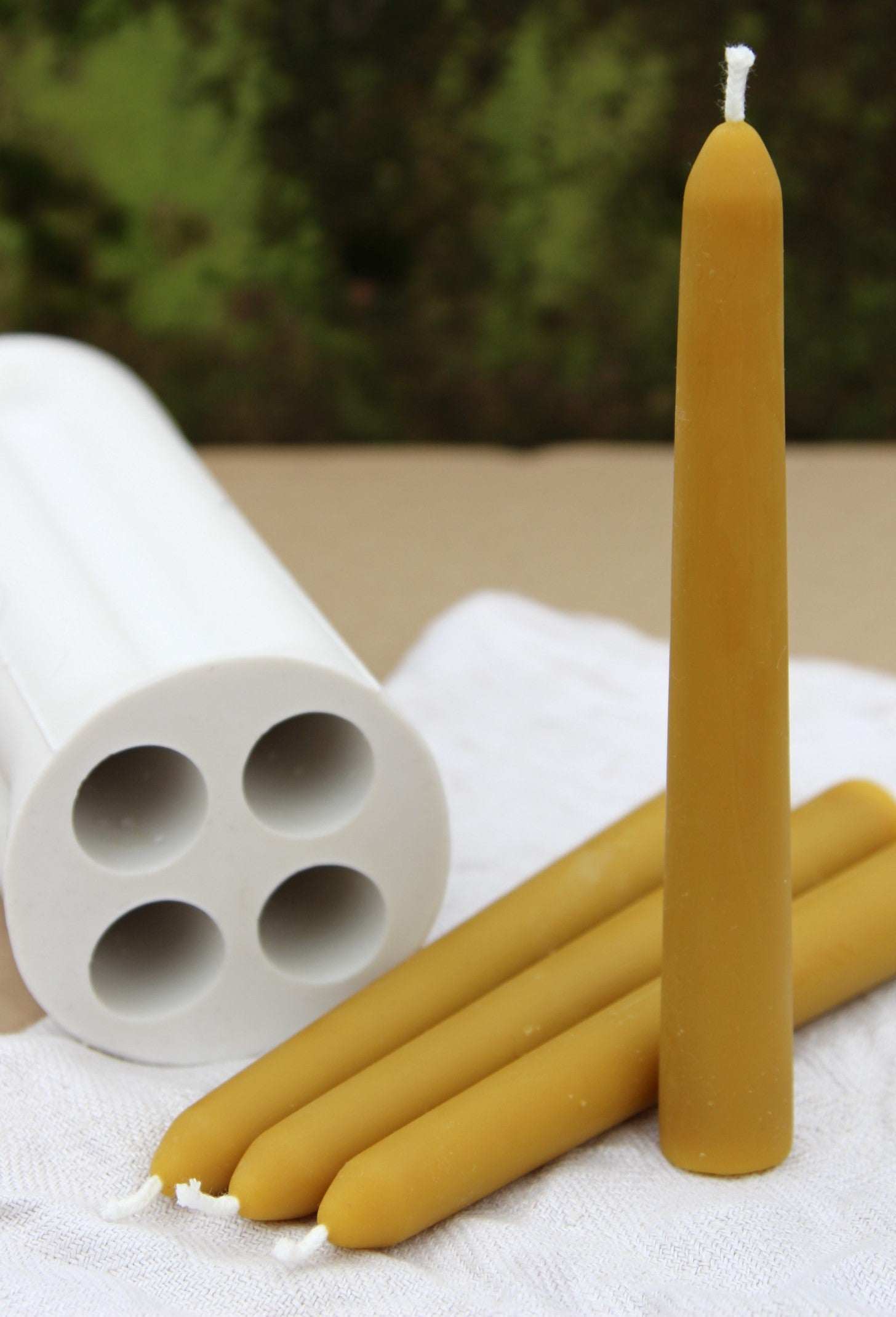 Silicone mold for casting straight beeswax taper candles