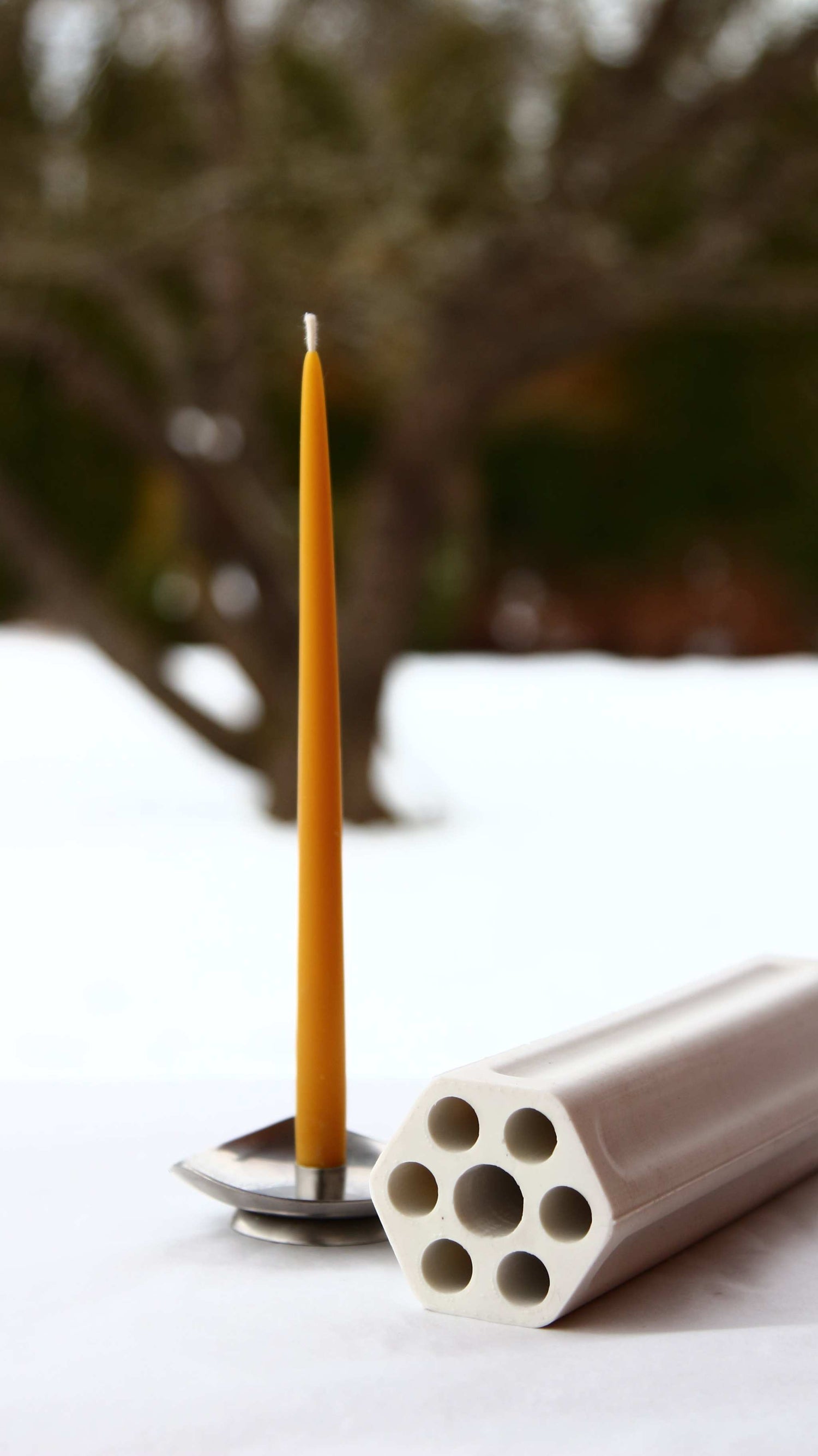 Slim beeswax taper candle measuring 20 × 1.3 cm