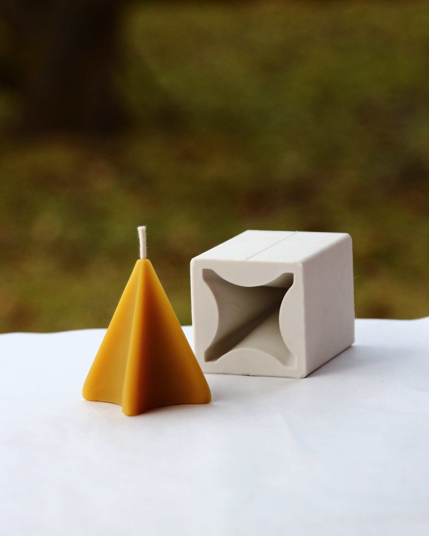 Beeswax candle with wavy peak silhouette