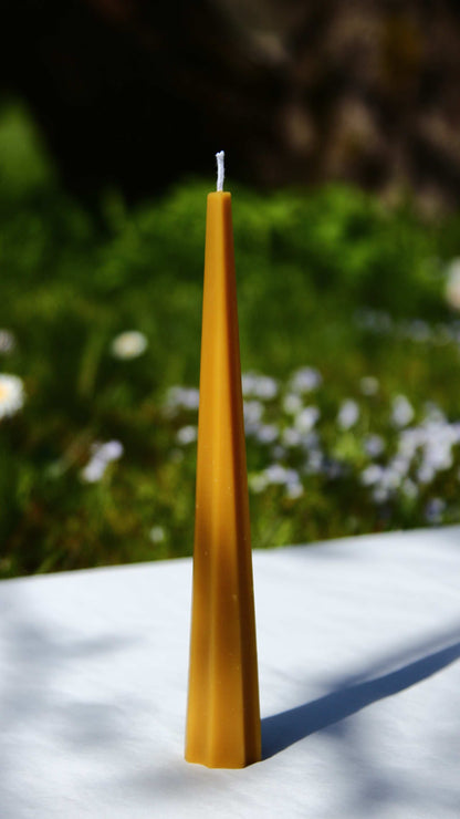 Machu Picchu Taper candle, 7.87 inches tall, 1.10 inches wide, outdoor background.