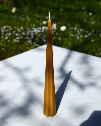 Machu Picchu Taper candle, 7.87 inches tall, on an outdoor background.