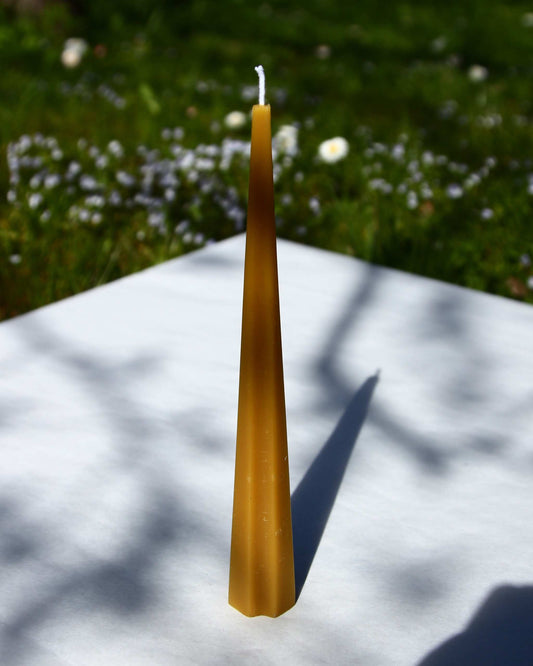 Machu Picchu Taper candle, 7.87 inches tall, on an outdoor background.