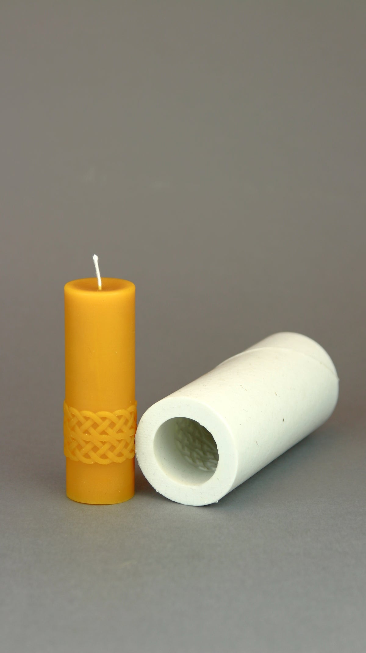 Karelia Motives beeswax candle beside the open silicone mould