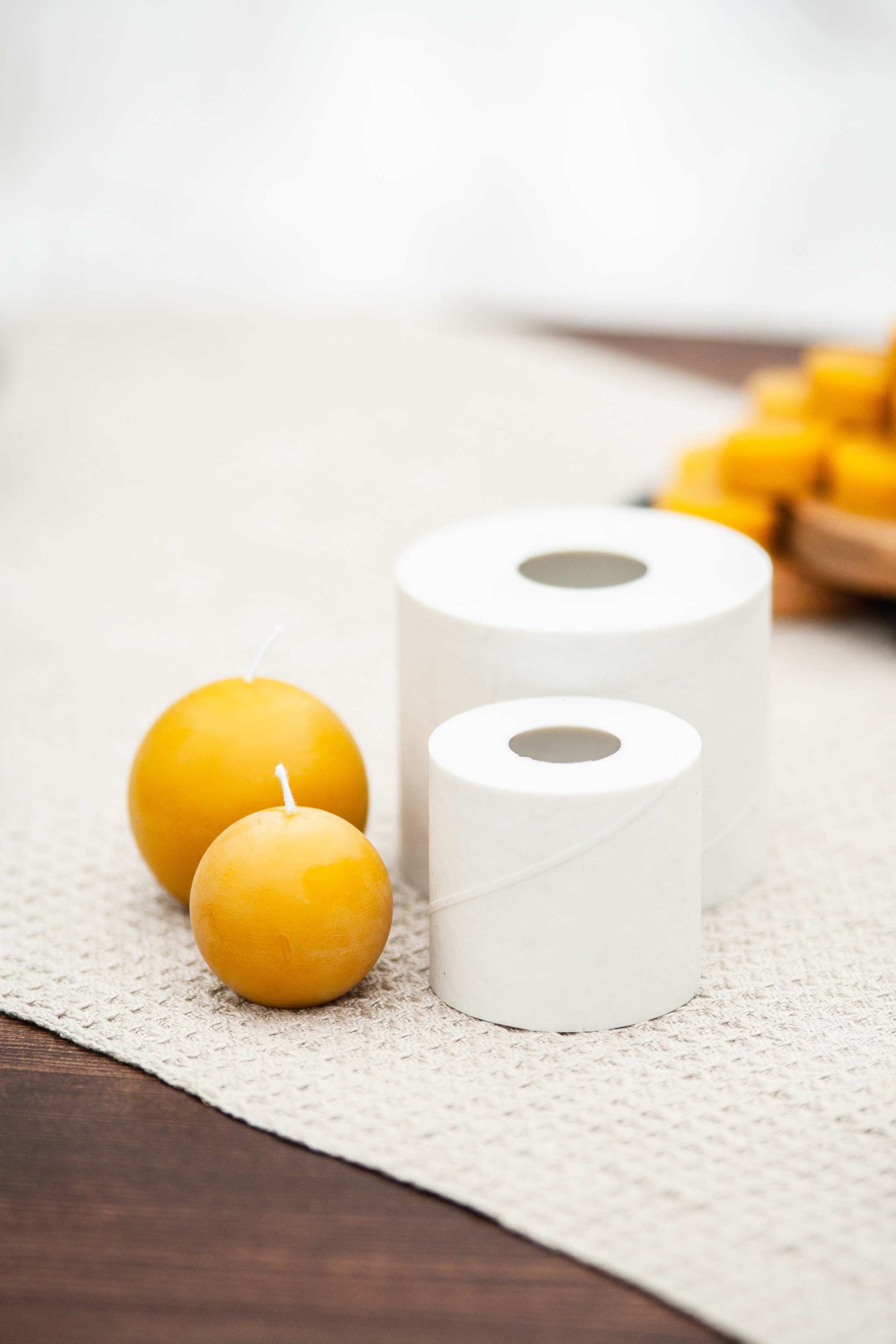 Beeswax candle next to silicone mold