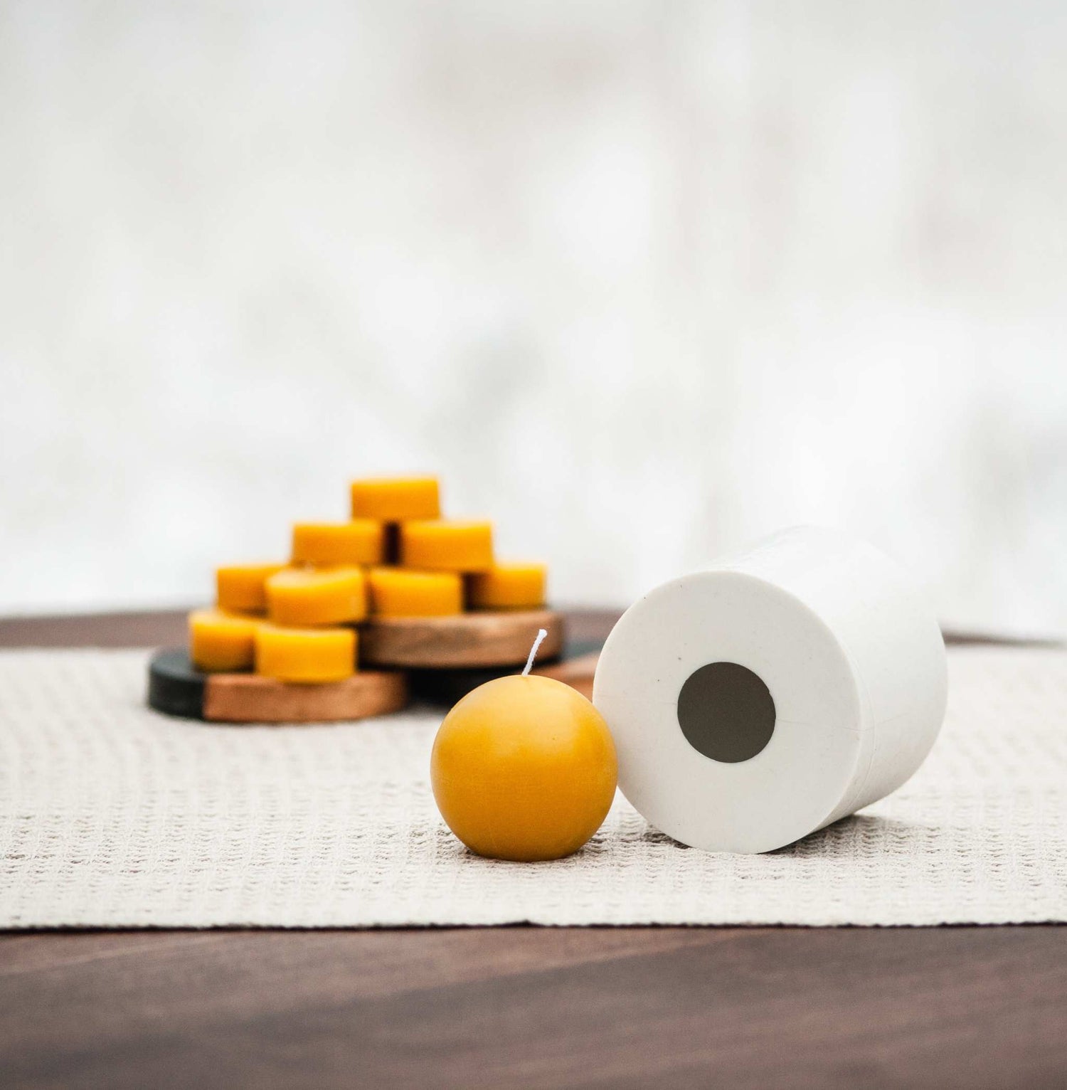 Spherical beeswax candle with smooth surface