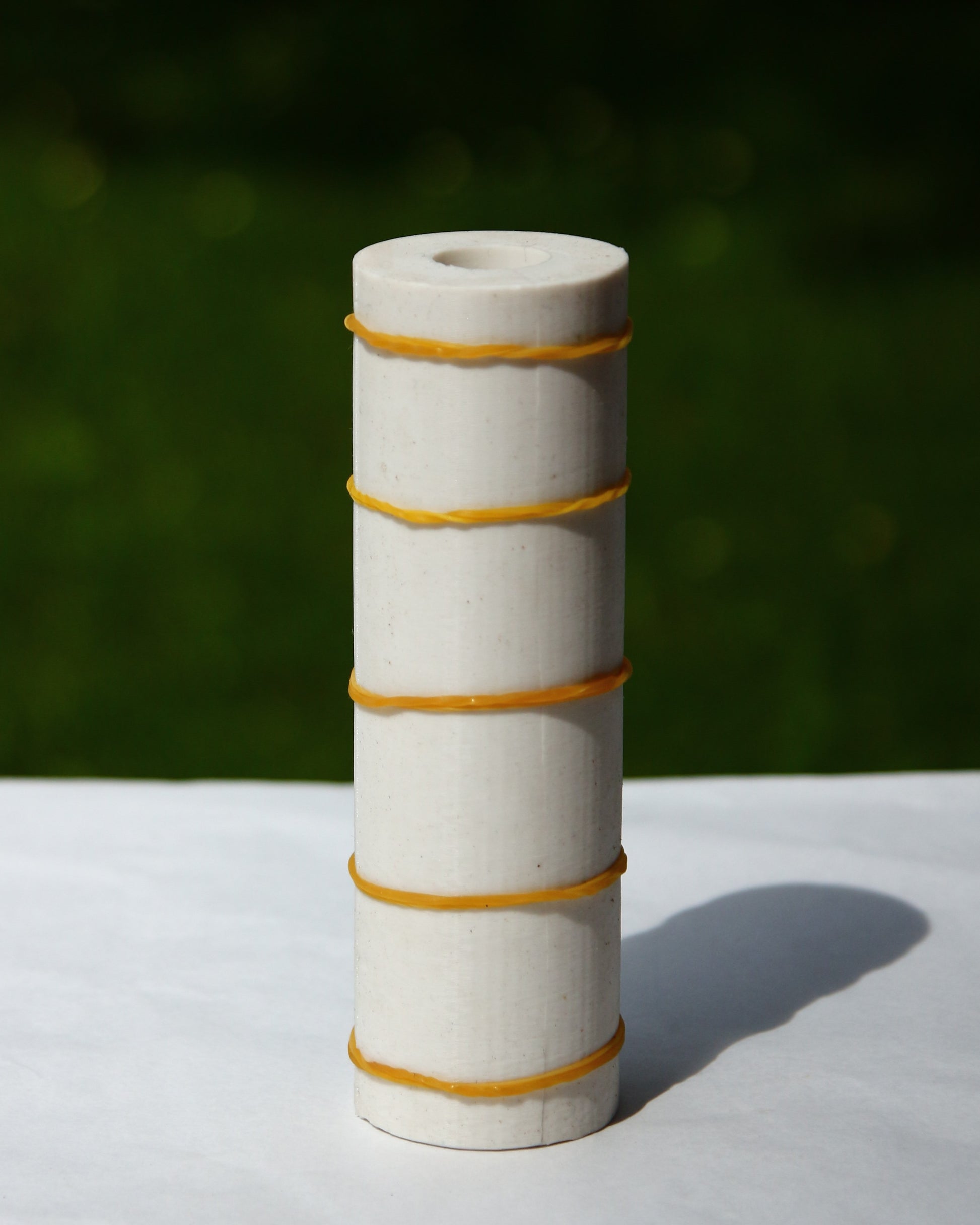 Decorative beeswax candle mold with sculptural bead design