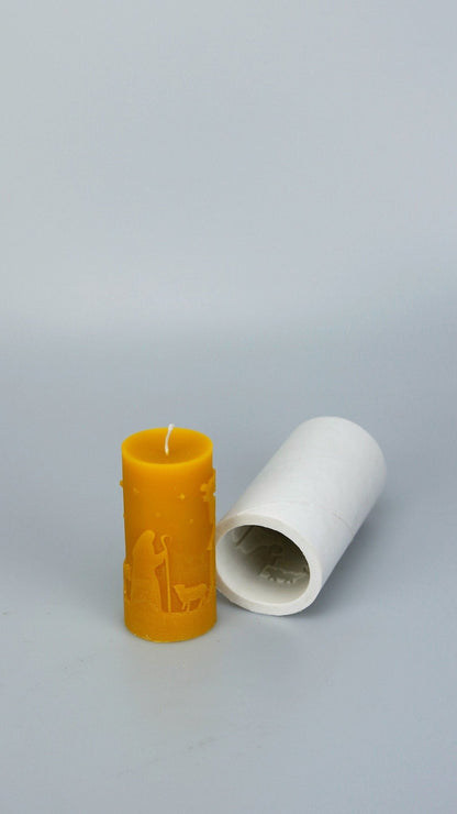 Beeswax Christmas Scene pillar candle next to its silicone mould