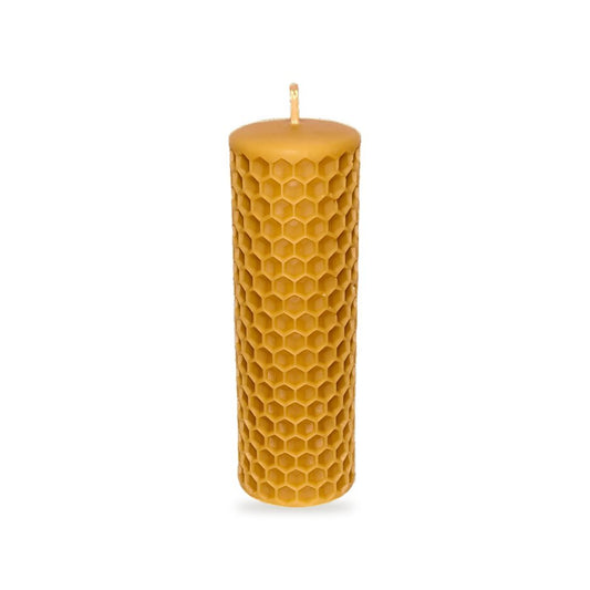 Bee Cells Pillars beeswax candle, white background studio photo
