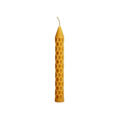 Bee Cells Pillars Solo beeswax candle, white background studio photo