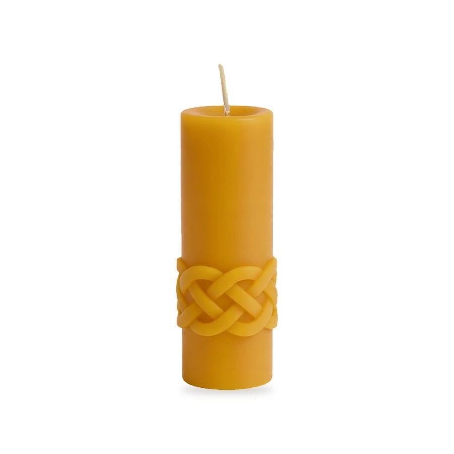 Celtic Waves beeswax candle, white background studio photo