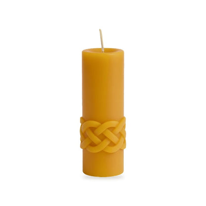 Celtic Waves beeswax candle, white background studio photo