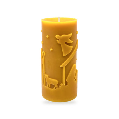 Christmas Scene beeswax candle, white background studio photo