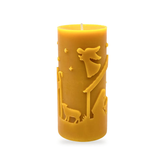 Christmas Scene beeswax candle, white background studio photo