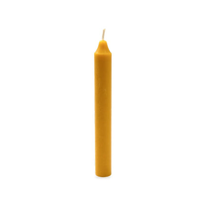 Daily beeswax candle, white background studio photo