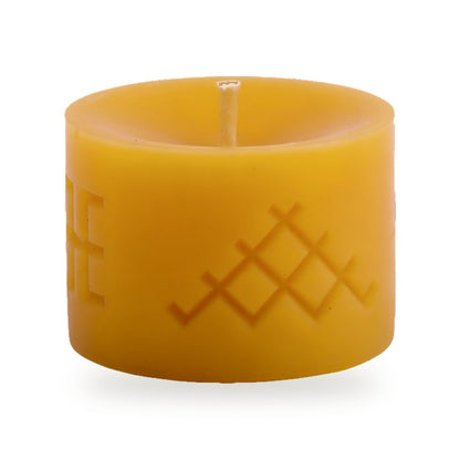 Ethno 2 beeswax candle, white background studio photo