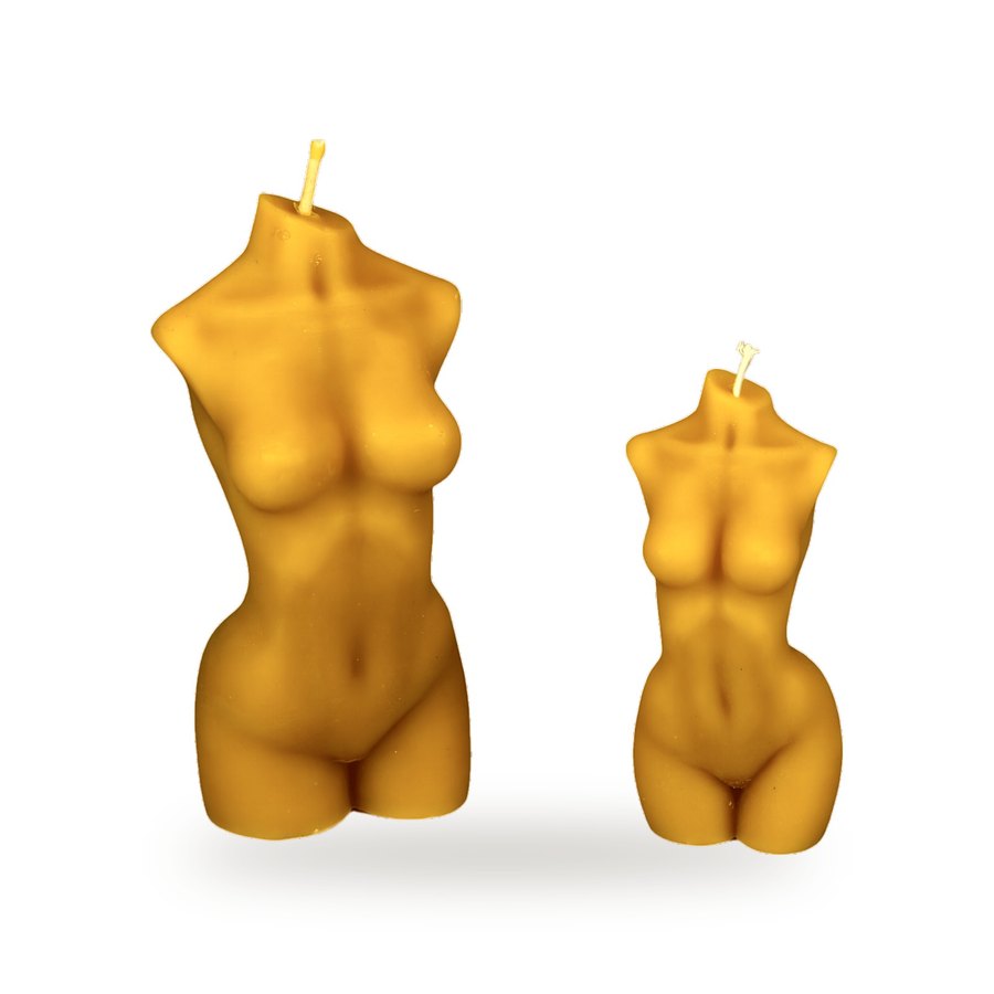 Female Body beeswax candle, white background studio photo