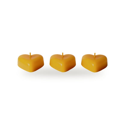 Floating Hearts beeswax candle, white background studio photo