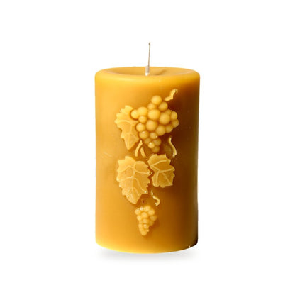 Grapes beeswax candle, white background studio photo