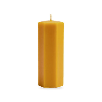 Hexagon beeswax candle, white background studio photo