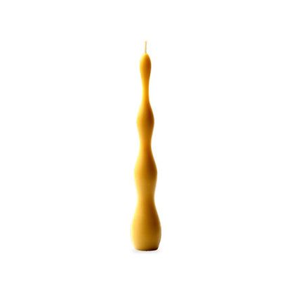 Light Waves beeswax candle, white background studio photo