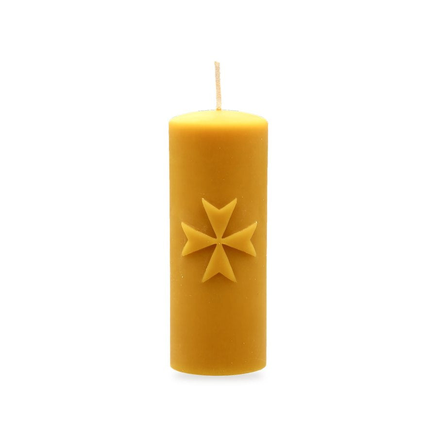 Maltese Cross beeswax candle, white background studio photo
