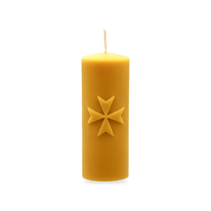 Maltese Cross beeswax candle, white background studio photo