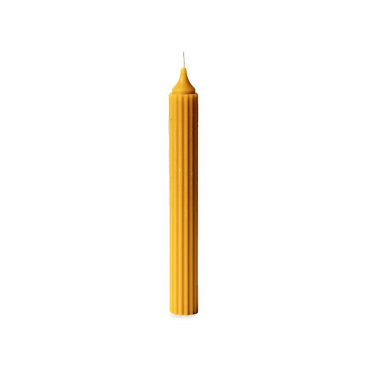 Pointy Fluted Taper beeswax candle, white background studio photo
