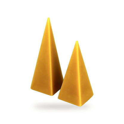 Pyramids beeswax candle, white background studio photo