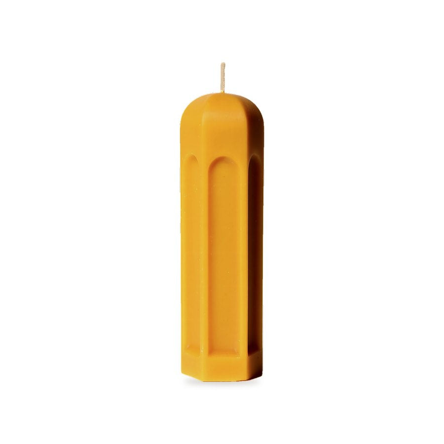 Quiet Pavilion beeswax candle, white background studio photo
