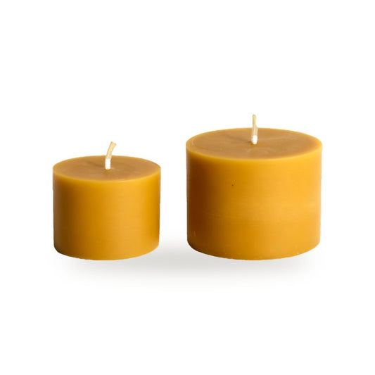 Simple Cylinders beeswax candle, white background studio photo
