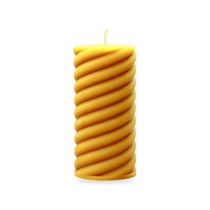 Spiral Pillars beeswax candle, white background studio photo