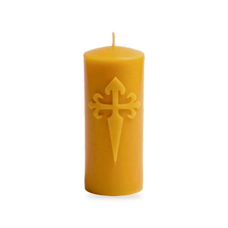 St James Cross beeswax candle, white background studio photo