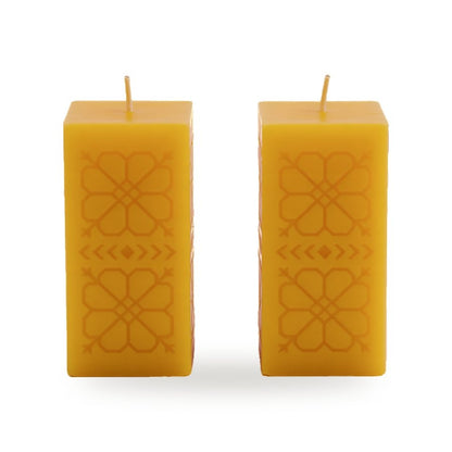 Sun Geometry beeswax candle, white background studio photo