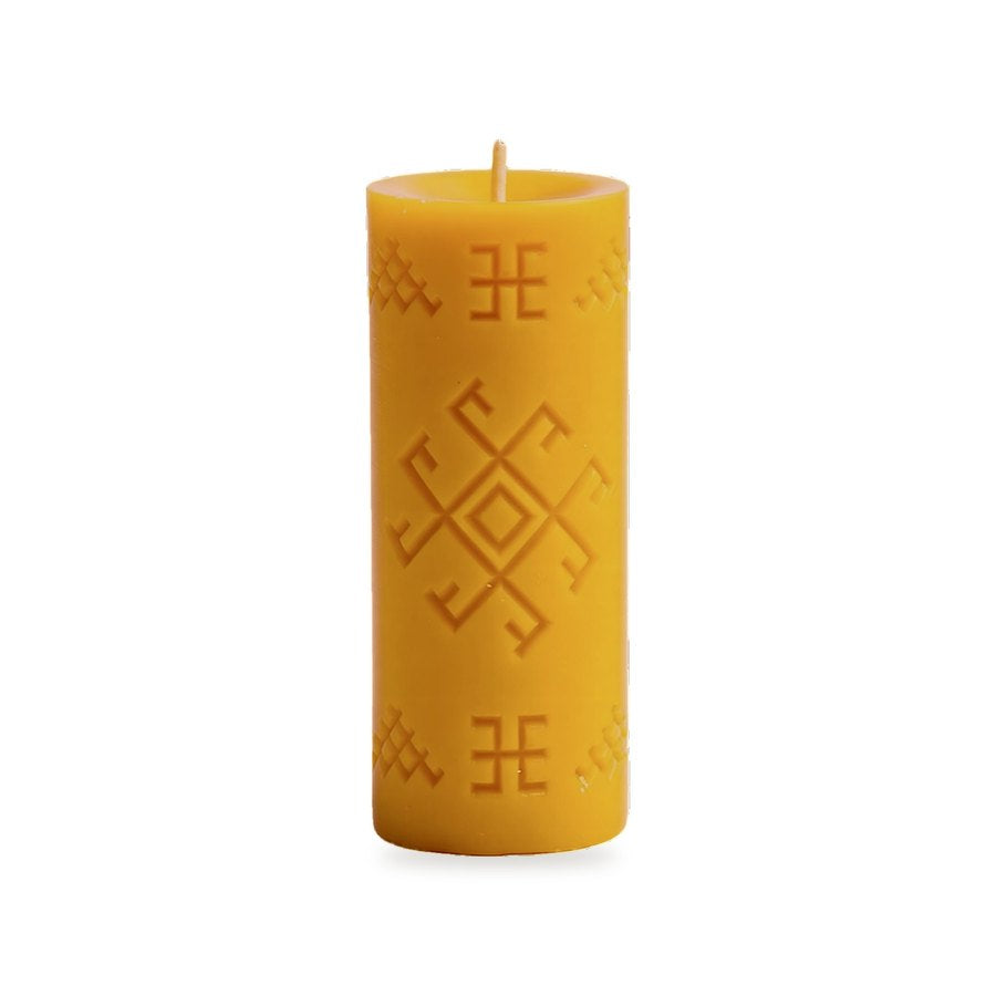 Thunder Cross beeswax candle, white background studio photo