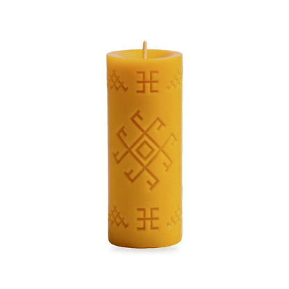 Thunder Cross beeswax candle, white background studio photo
