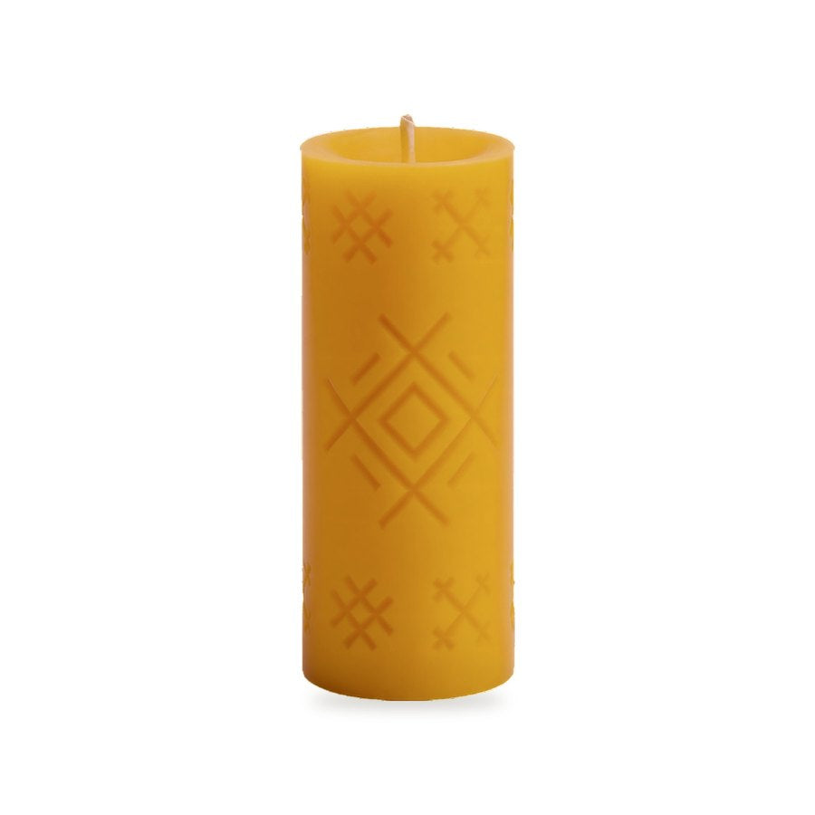 Well Mark beeswax candle, white background studio photo